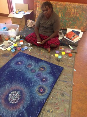 Alma Nungarrayi Granites painting at her community art centre in Yuendumu